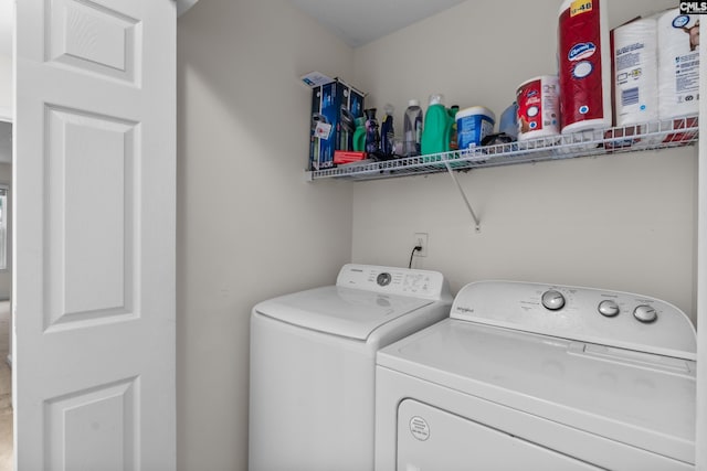 laundry room with independent washer and dryer