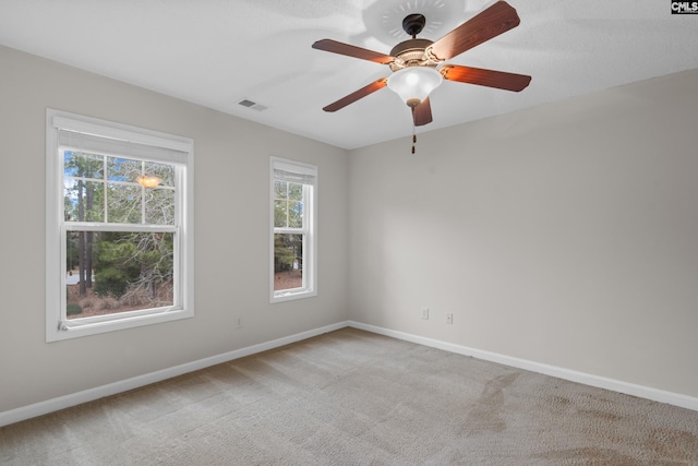 unfurnished room with carpet floors and ceiling fan