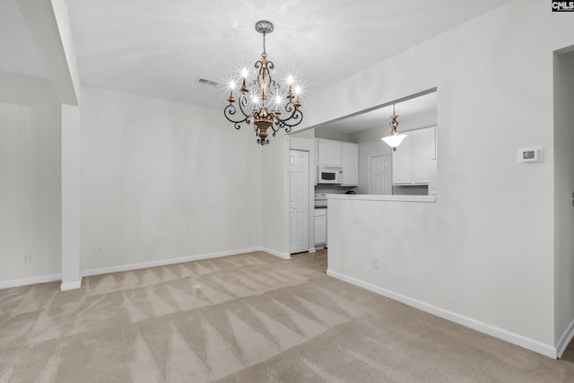 interior space featuring light carpet and an inviting chandelier