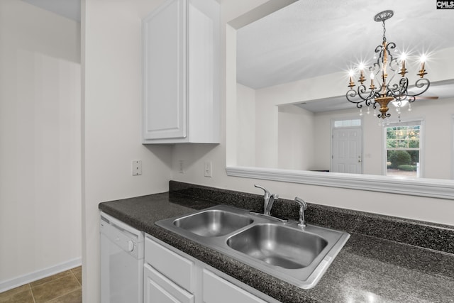 kitchen featuring dishwasher, sink, a chandelier, decorative light fixtures, and white cabinets