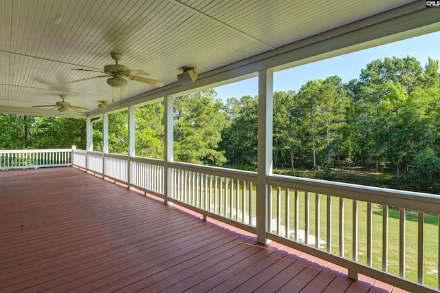 deck featuring a yard and ceiling fan