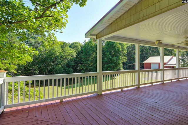 wooden deck with a lawn