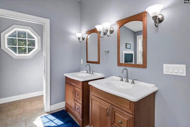 bathroom with tile patterned flooring and vanity