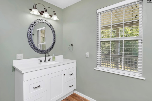 bathroom with hardwood / wood-style floors and vanity