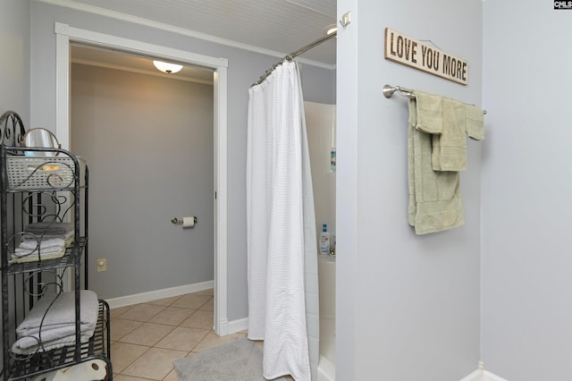 bathroom with tile patterned floors, crown molding, and walk in shower