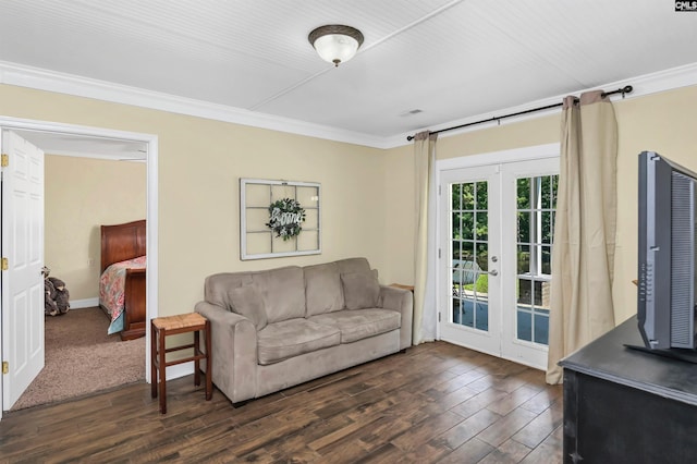 living room with crown molding, french doors, and dark hardwood / wood-style floors