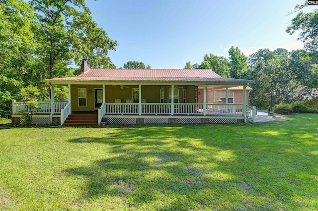 view of front of home with a front yard and a porch