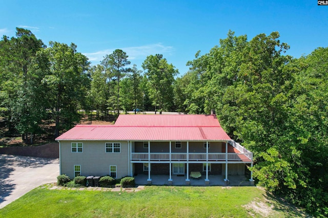 rear view of house with a lawn