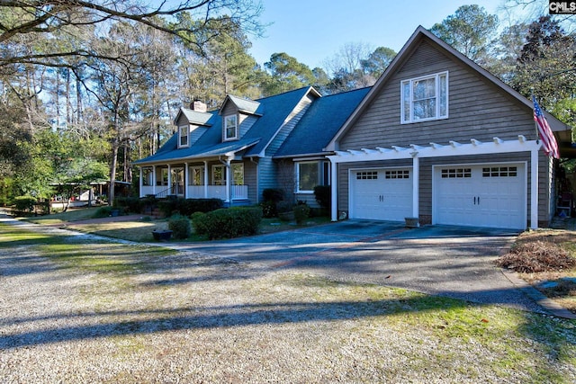 view of front facade with a porch and a garage