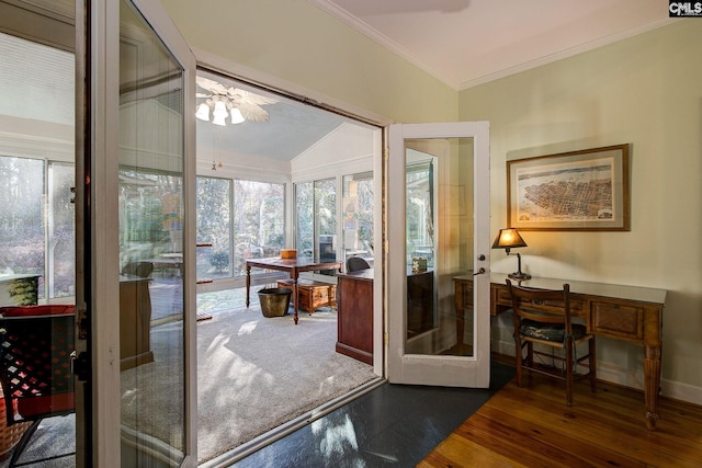 interior space featuring french doors, lofted ceiling, dark hardwood / wood-style floors, and ornamental molding