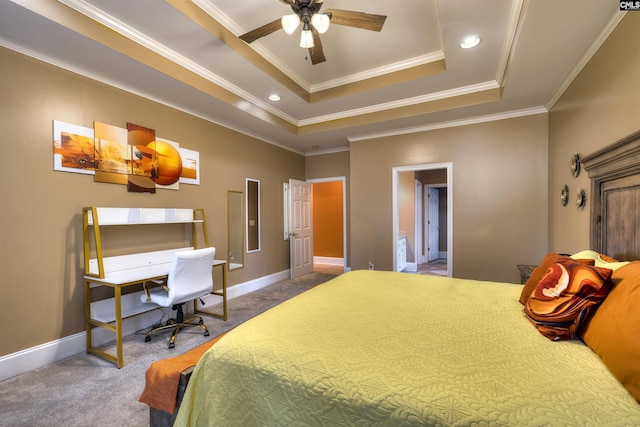 bedroom featuring a raised ceiling, crown molding, carpet, and ceiling fan