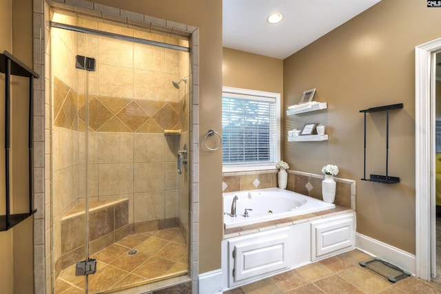 bathroom with tile patterned flooring and shower with separate bathtub