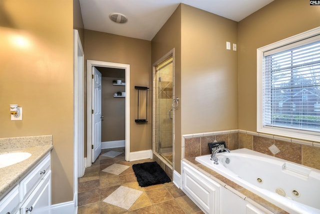 bathroom with shower with separate bathtub, vanity, tile patterned floors, and plenty of natural light