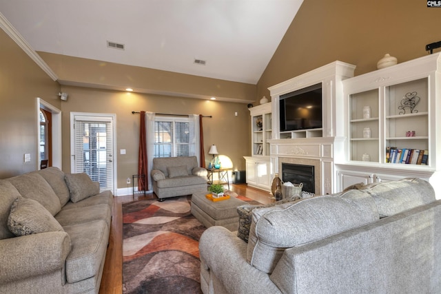 living room featuring hardwood / wood-style floors and lofted ceiling