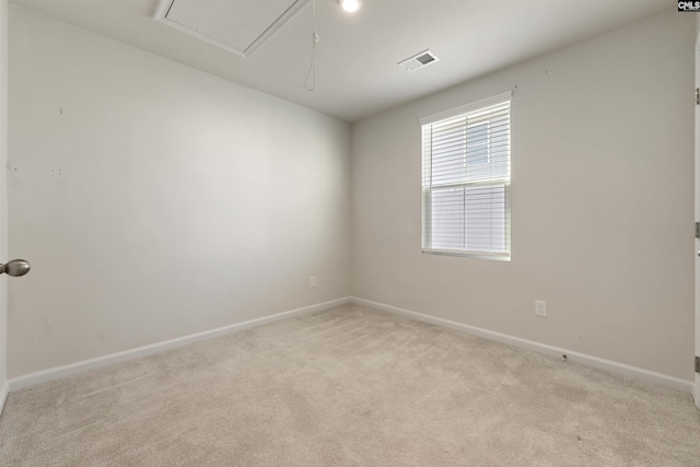 unfurnished room with light carpet