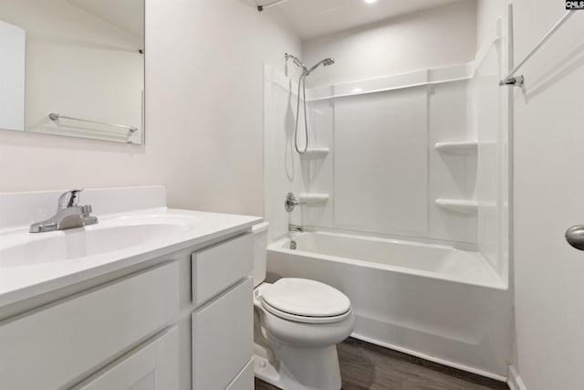 full bathroom featuring hardwood / wood-style flooring, vanity, toilet, and shower / bathing tub combination