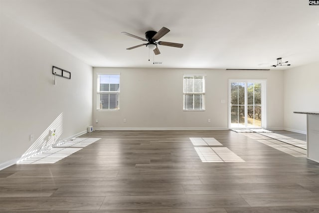 spare room featuring hardwood / wood-style floors and ceiling fan