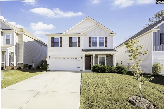 view of front of property with driveway, a garage, stone siding, a front lawn, and board and batten siding