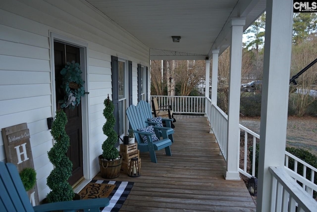 wooden terrace featuring a porch