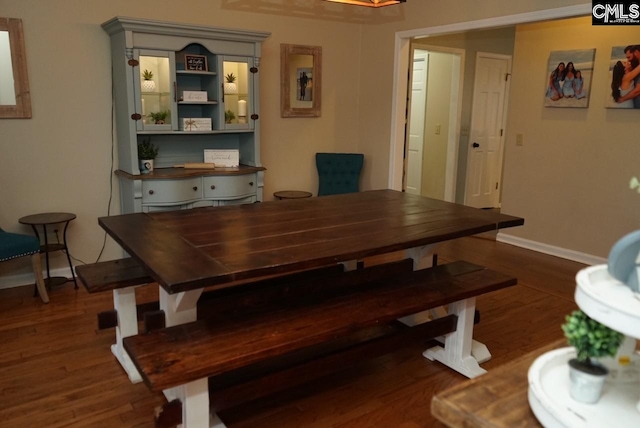 dining room with dark wood-type flooring