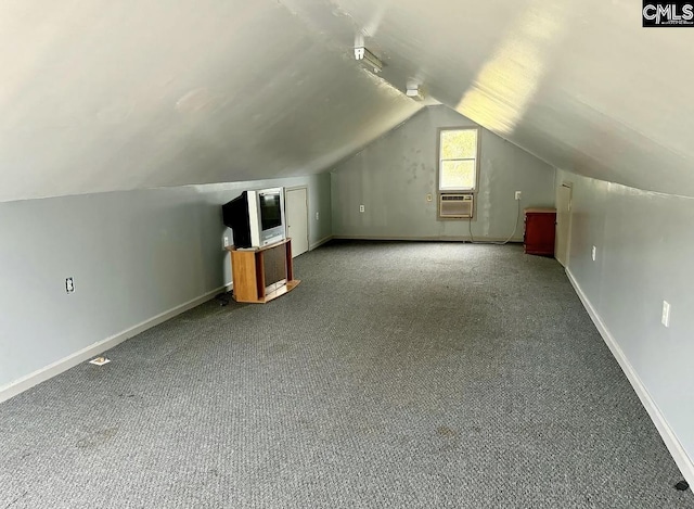 bonus room featuring vaulted ceiling and carpet