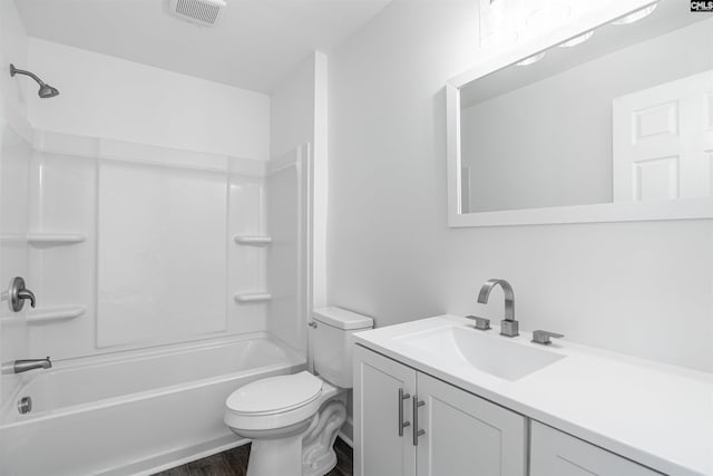 full bathroom featuring toilet, shower / bathing tub combination, wood-type flooring, and vanity