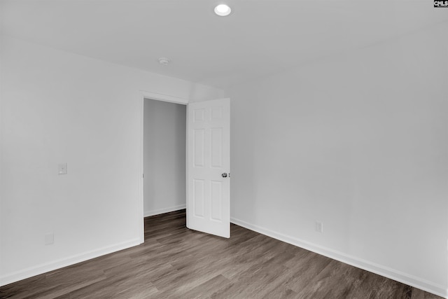 spare room with hardwood / wood-style floors