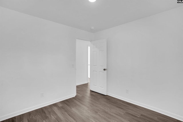 spare room featuring dark hardwood / wood-style floors