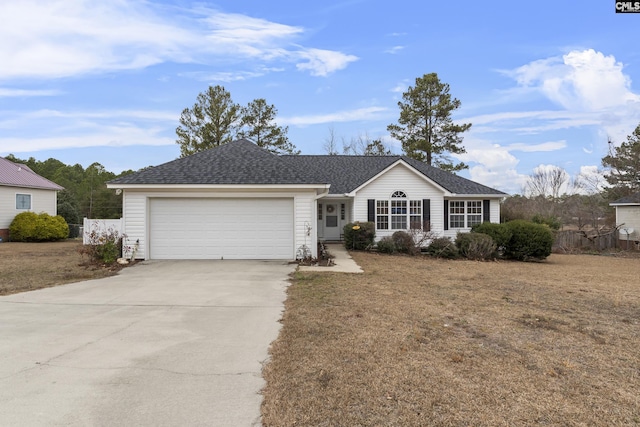 single story home with a front yard and a garage