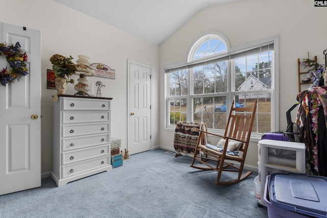 sitting room with lofted ceiling and carpet