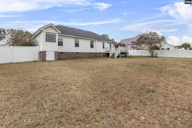 back of house with a yard