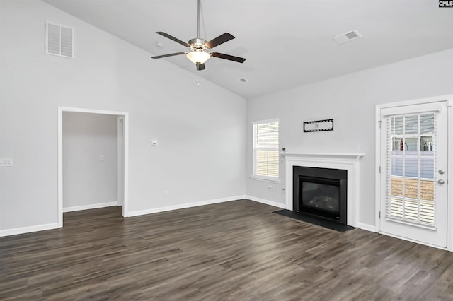 unfurnished living room with lofted ceiling, ceiling fan, and dark wood-type flooring