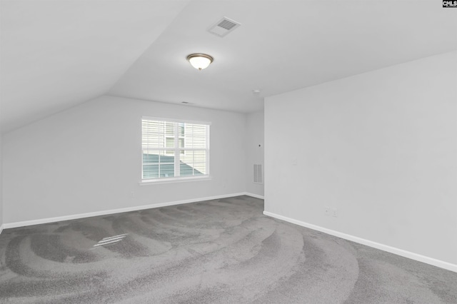 bonus room with carpet and lofted ceiling