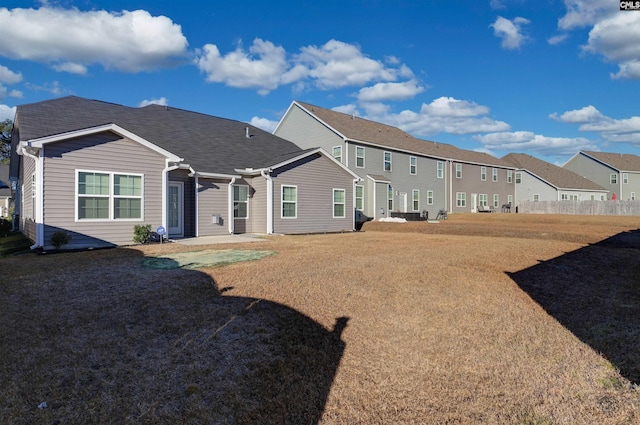 back of house featuring a yard and a patio