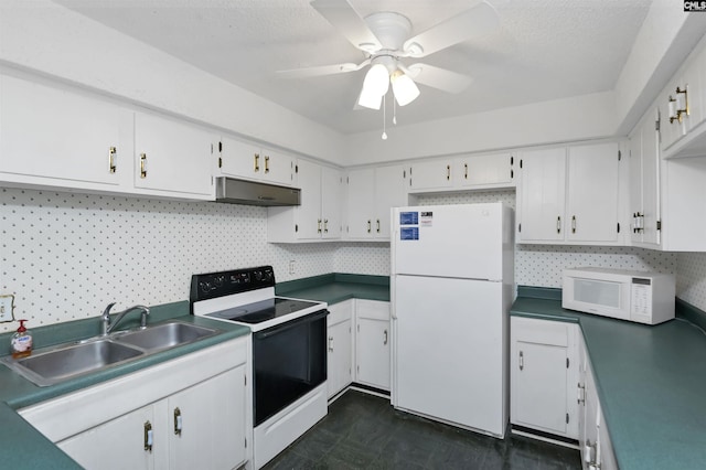 kitchen with white appliances, ceiling fan, white cabinets, and sink