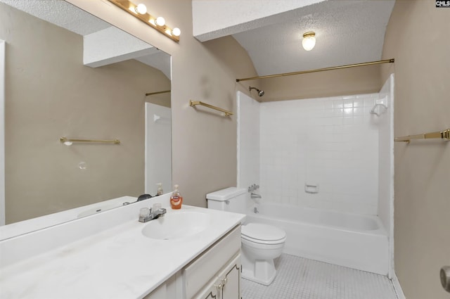 full bathroom featuring a textured ceiling, tiled shower / bath, tile patterned floors, and vanity