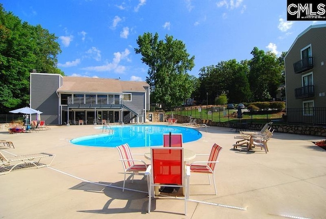 view of pool featuring a patio