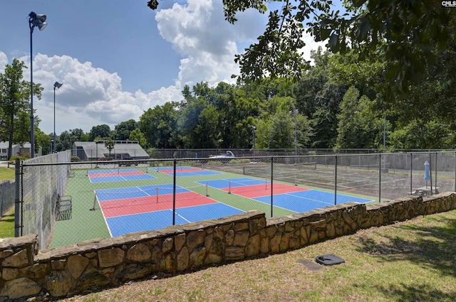 view of basketball court featuring tennis court