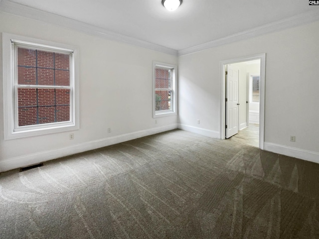 carpeted empty room with crown molding