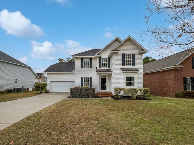 view of front property with a garage and a front yard