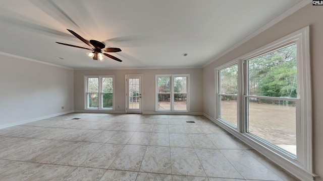 unfurnished room featuring ceiling fan, plenty of natural light, and crown molding