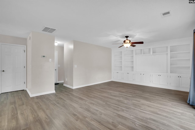 interior space with ceiling fan, light hardwood / wood-style floors, and built in features