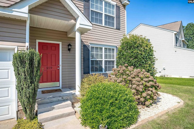 property entrance with a garage