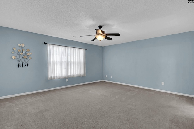 empty room featuring a textured ceiling, ceiling fan, and carpet