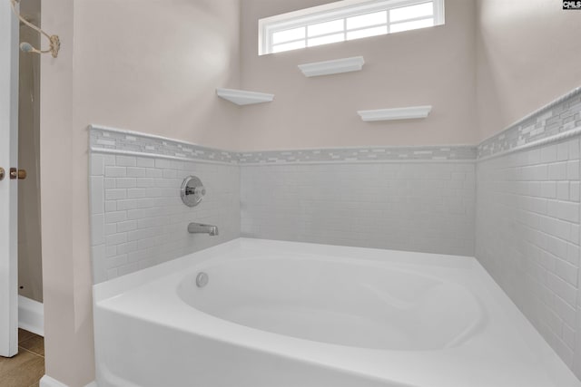 bathroom featuring a tub