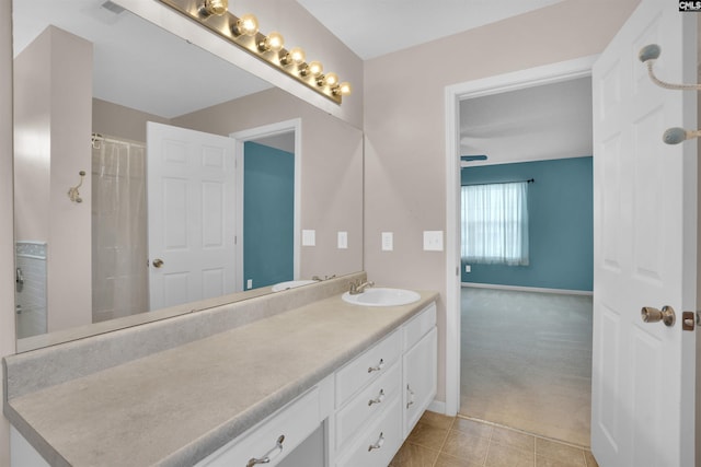 bathroom with vanity and curtained shower