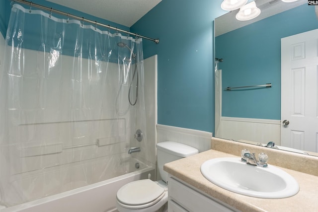 full bathroom featuring a textured ceiling, toilet, wood walls, shower / bath combo with shower curtain, and vanity