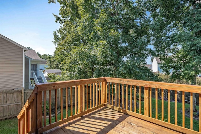 wooden deck with a yard