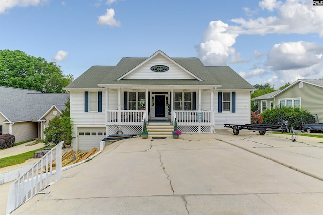 view of front of house with a porch and a garage