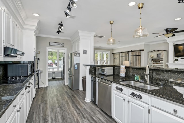 kitchen with sink, white cabinetry, plenty of natural light, pendant lighting, and appliances with stainless steel finishes